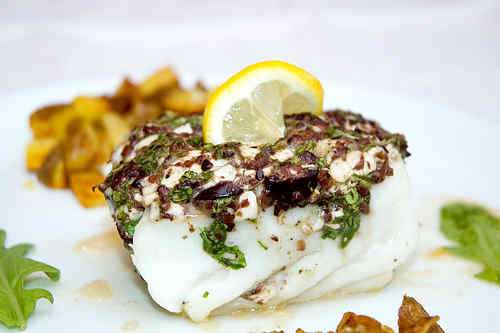 Photo of Halibut topped with Olives, Arugula and Cottage Cheese