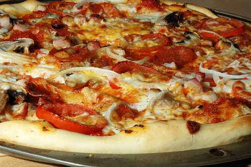 Photo of Pizza with Bacon, Pepperoni and Garlic